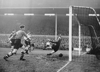 Les Bennett scores for Tottenham against Wolves in November 1951.