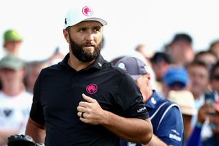 Jon Rahm walks off the green