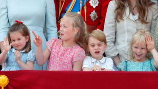 Princess Charlotte of Cambridge, Savannah Phillips, Prince George of Cambridge and Isla Phillips stand on the balcony of Buckingham Palace during Trooping The Colour 2018 on June 9, 2018 in London, England
