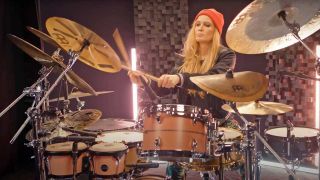 Anika Nilles playing the drums