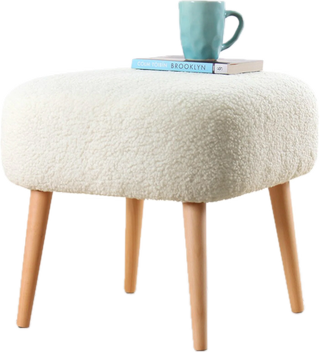 Boucle footstool with wooden legs