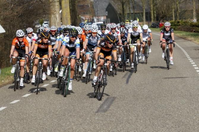 Emily Collins (Wiggle Honda Team) leads the chasers, policed by Orica - AIS riders