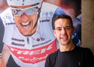 Richie Porte with a giant photo of him winning the 2020 Tour Down Under