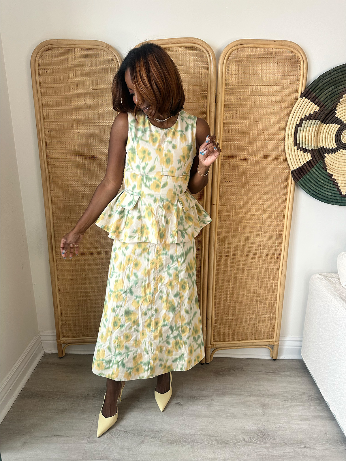 Who What Wear Editor in Residence Tiffany Reid wearing a floral poplin matching set for a TV segment.