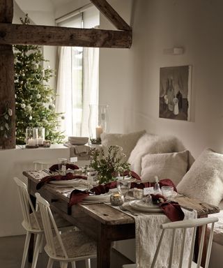 Christmas table with burgundy and white theme by The White Company
