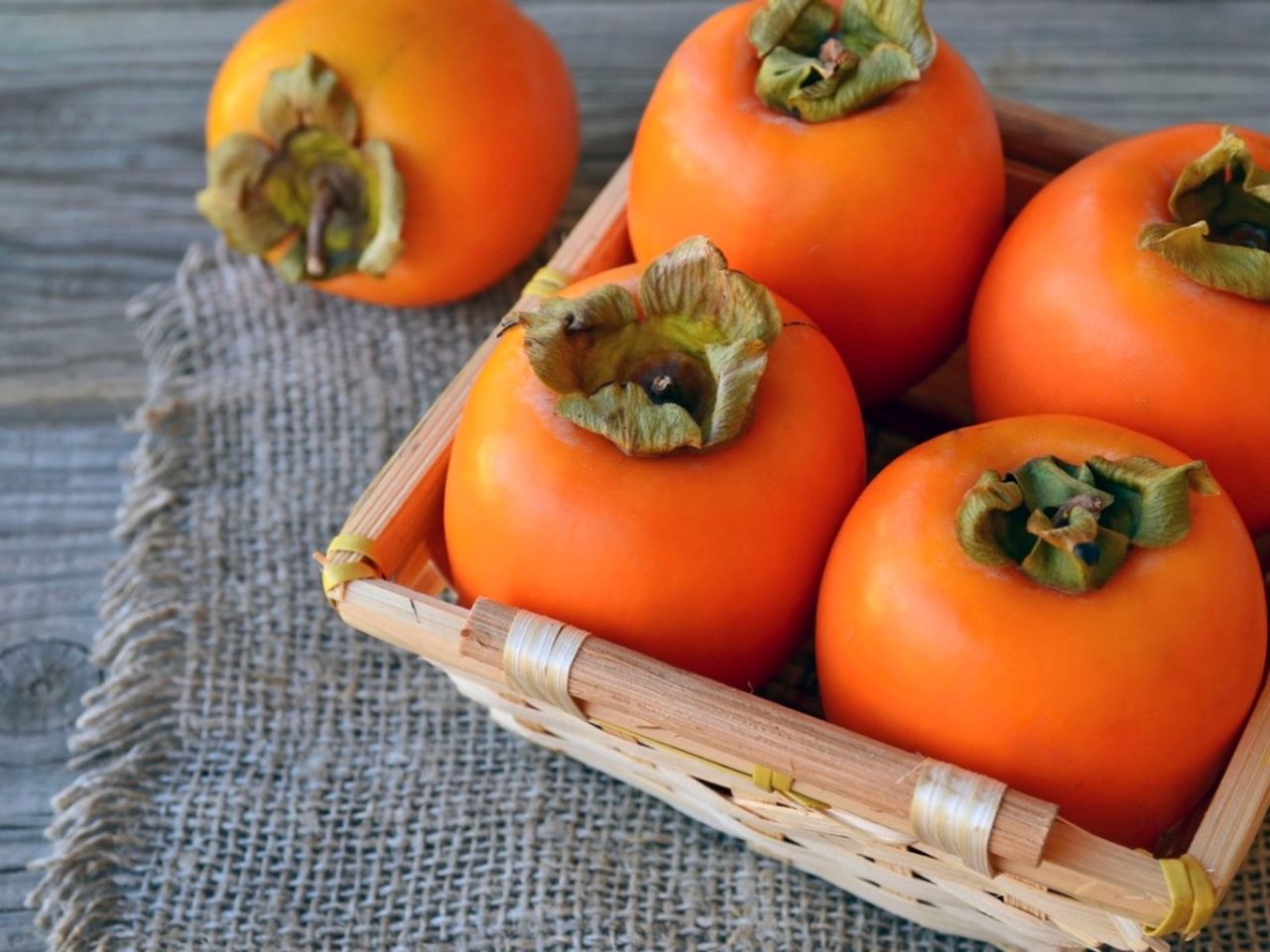 A Basket Of Kaki Japanese Persimmons