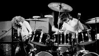 Keith Moon drumming onstage as Roger Daltrey looks on