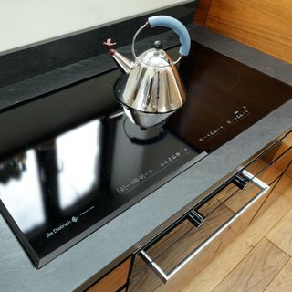 black hob with alessi kettle