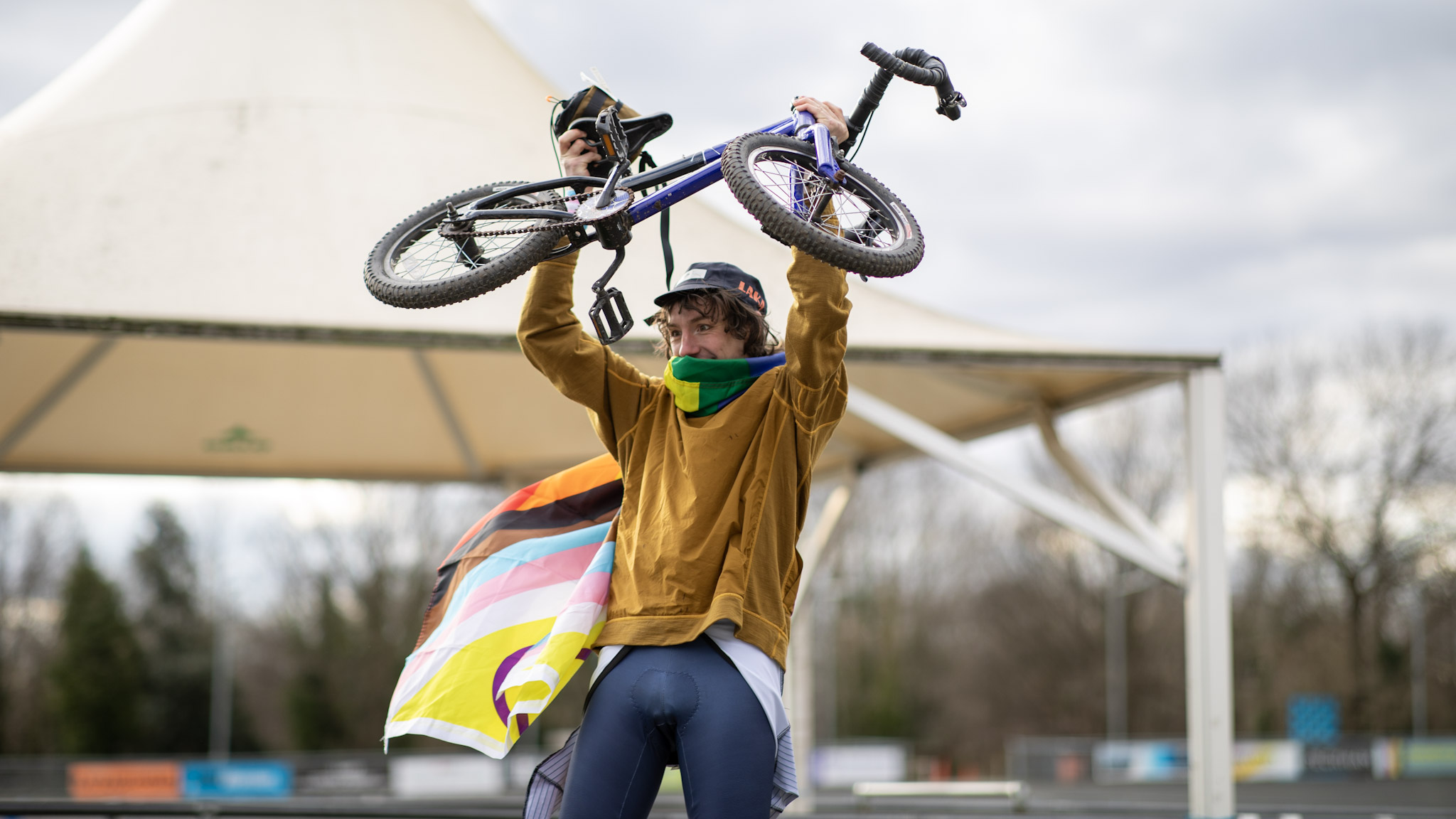Man raises bike over his head