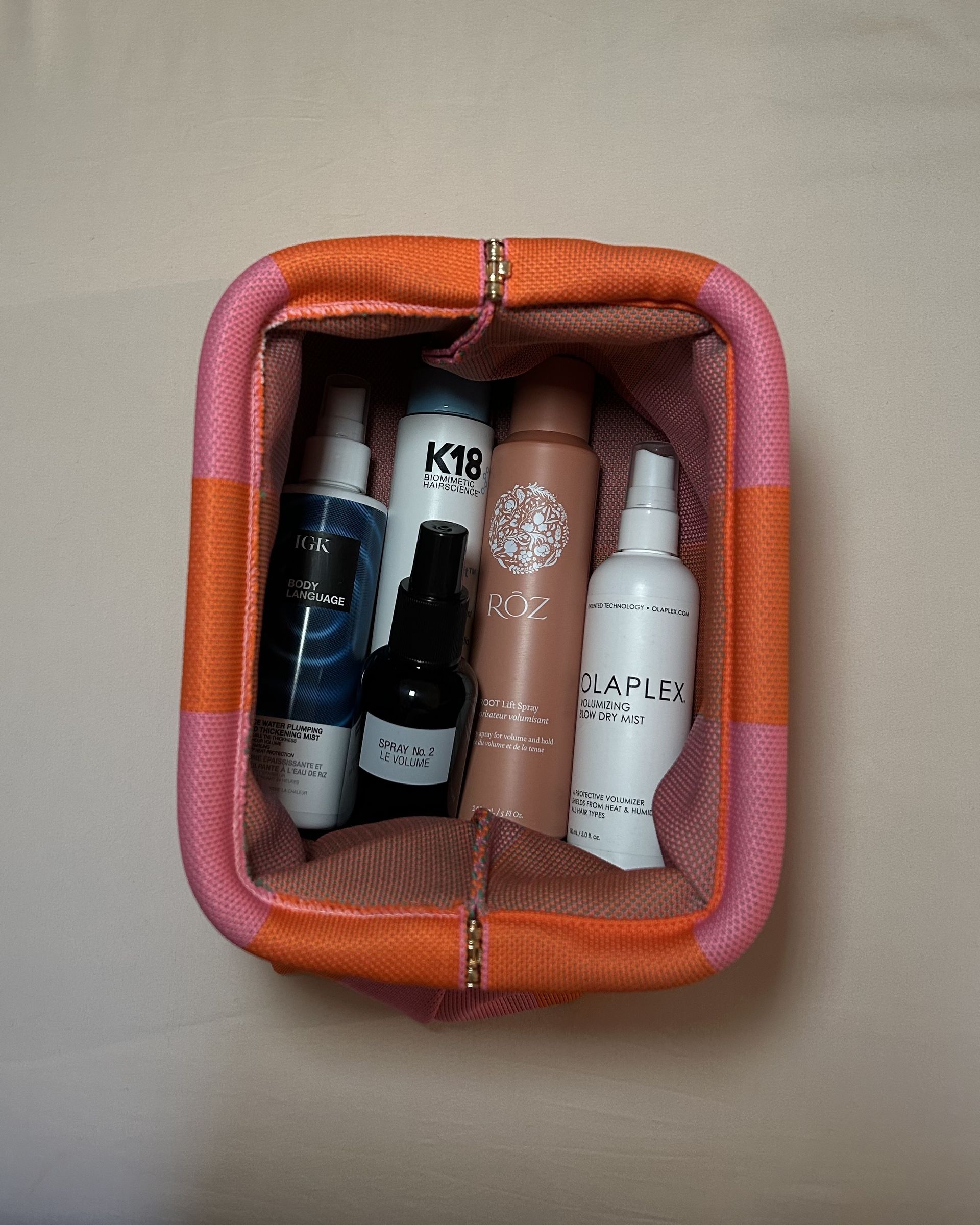 Alyssa Brascia's bag of hair volumizing sprays.