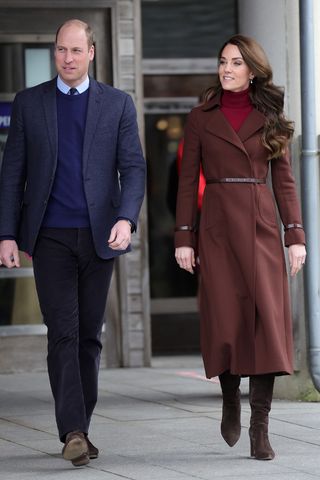 Kate Middleton wears a brown coat and matching boots as she visits the National Maritime Museum Cornwall with Prince William, Duke of Cornwall on February 09, 2023 in Falmouth, England