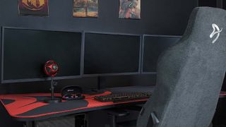 Arozzi’s Arena Ultrawide gaming desk with three monitors on top