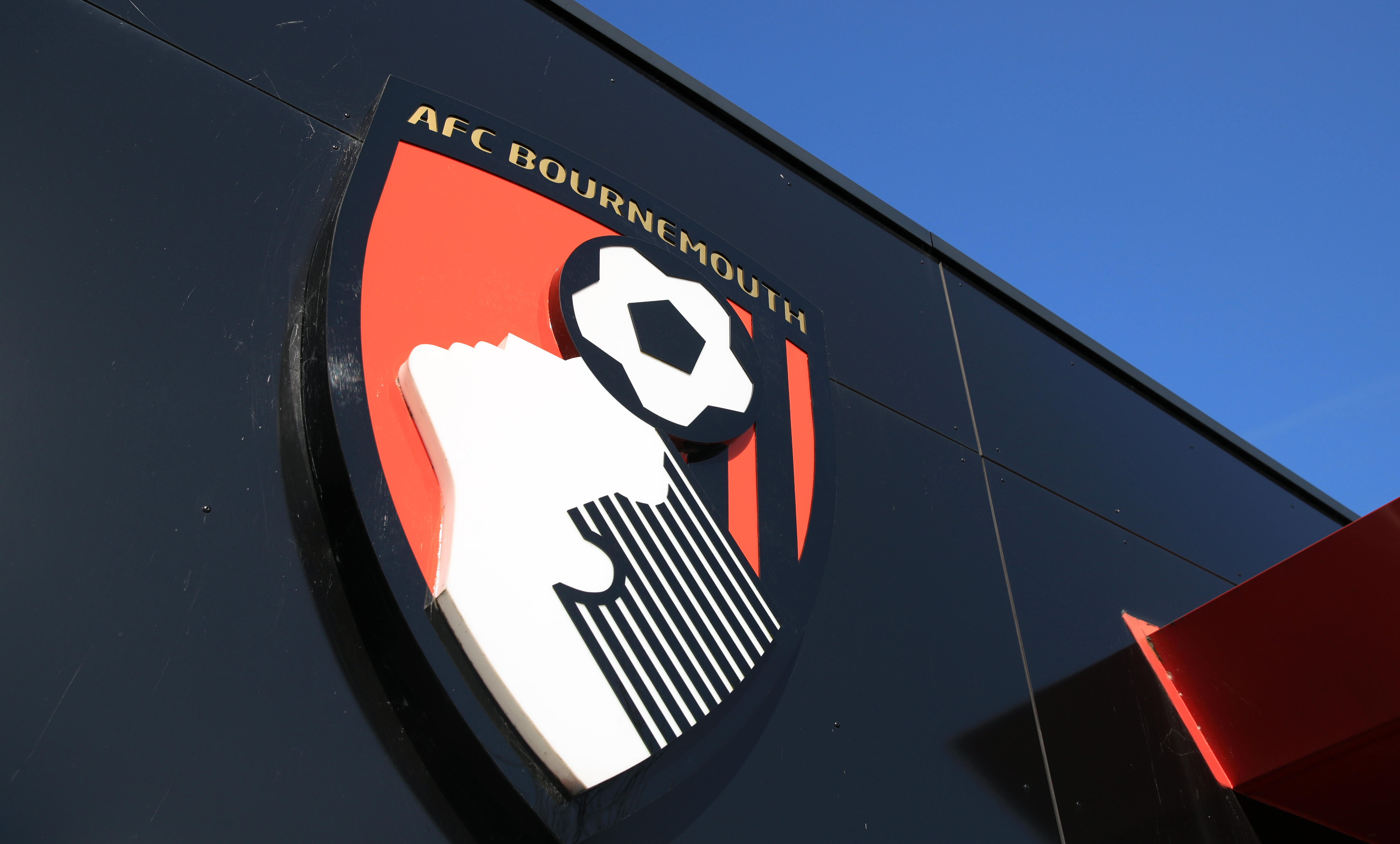 The AFC Bournemouth badge on a black background at the Vitality Stadium