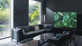 Samsung 2023 OLED in a dark living room with green abstract image onscreen