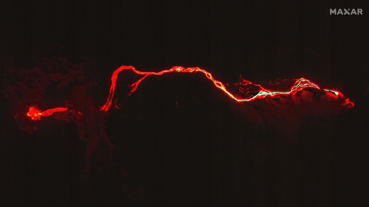 The glowing river of lava from the Cumbre Vieja volcano can be seen reaching the Atlantic Ocean in this image obtained by Maxar Technologies on 29 Sept. 2021.