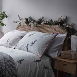 Christmas bedroom with mistletoe decorated headboard