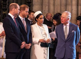 Prince Charles talks with Prince William, Prince Harry and Meghan Markle as they all attend the Commonwealth Day service