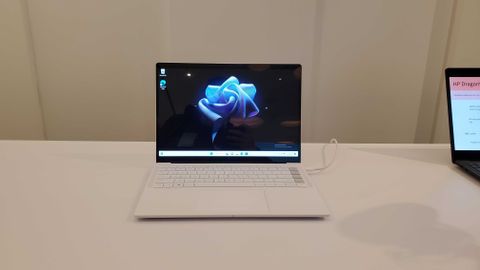 white HP Dragonfly Pro with a flower background
