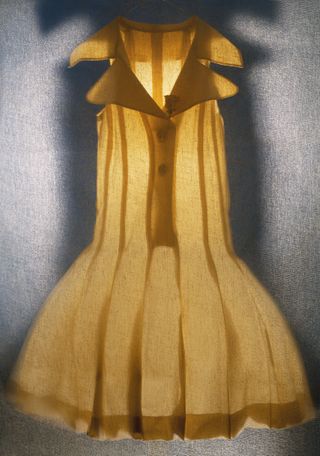 still life photo of a backlit yellow dress