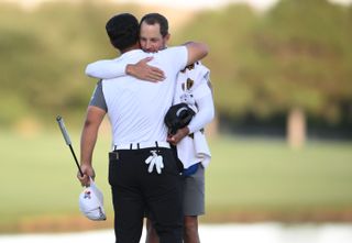 Kim hugs his caddie after his victory