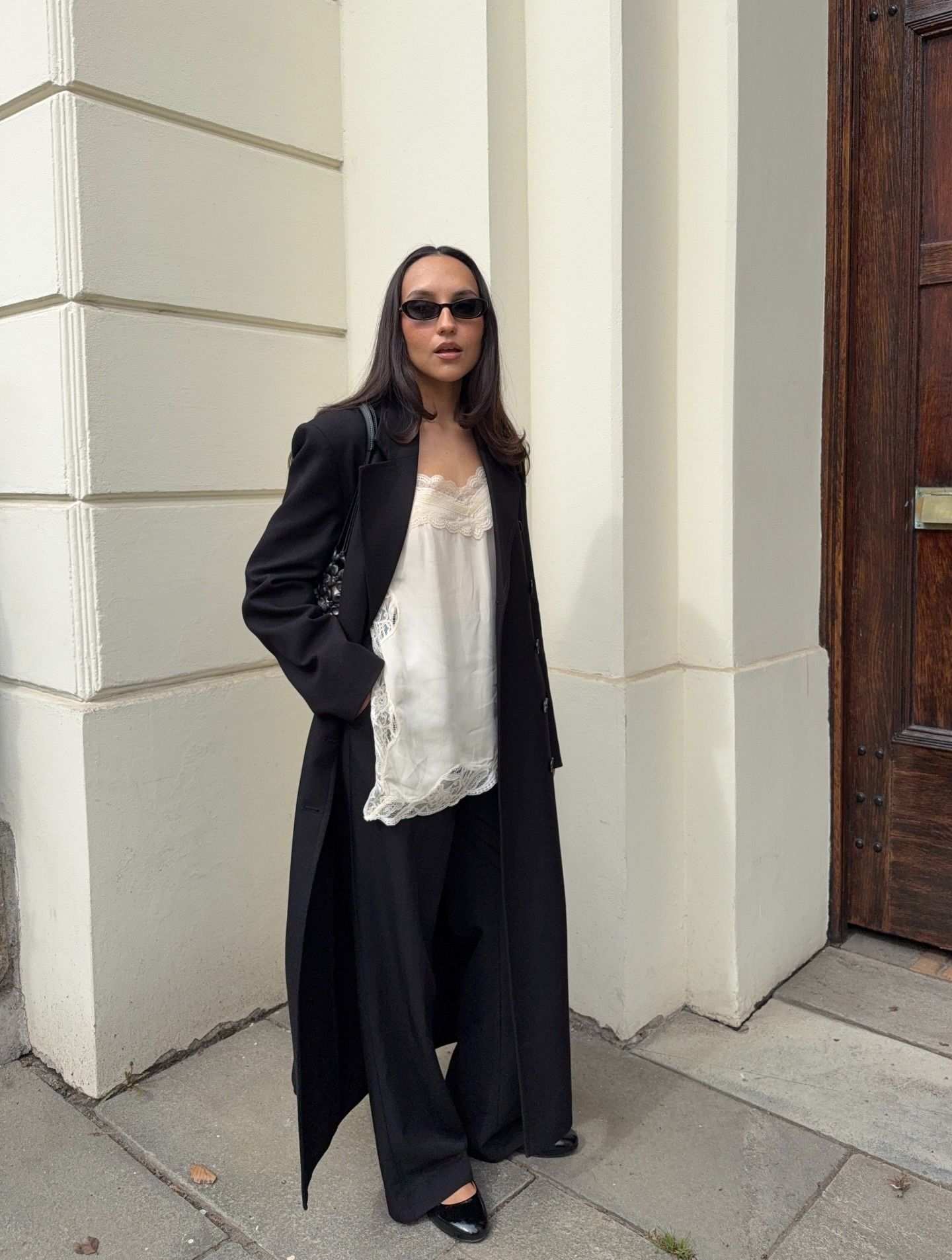 Influencer wearing spring 2026 outfit with silk pants.