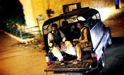 Armed members of Pakistan's anti-terrorism police patrol the streets of Karachi: Pakistan is demanding that the CIA leave the country once and for all.