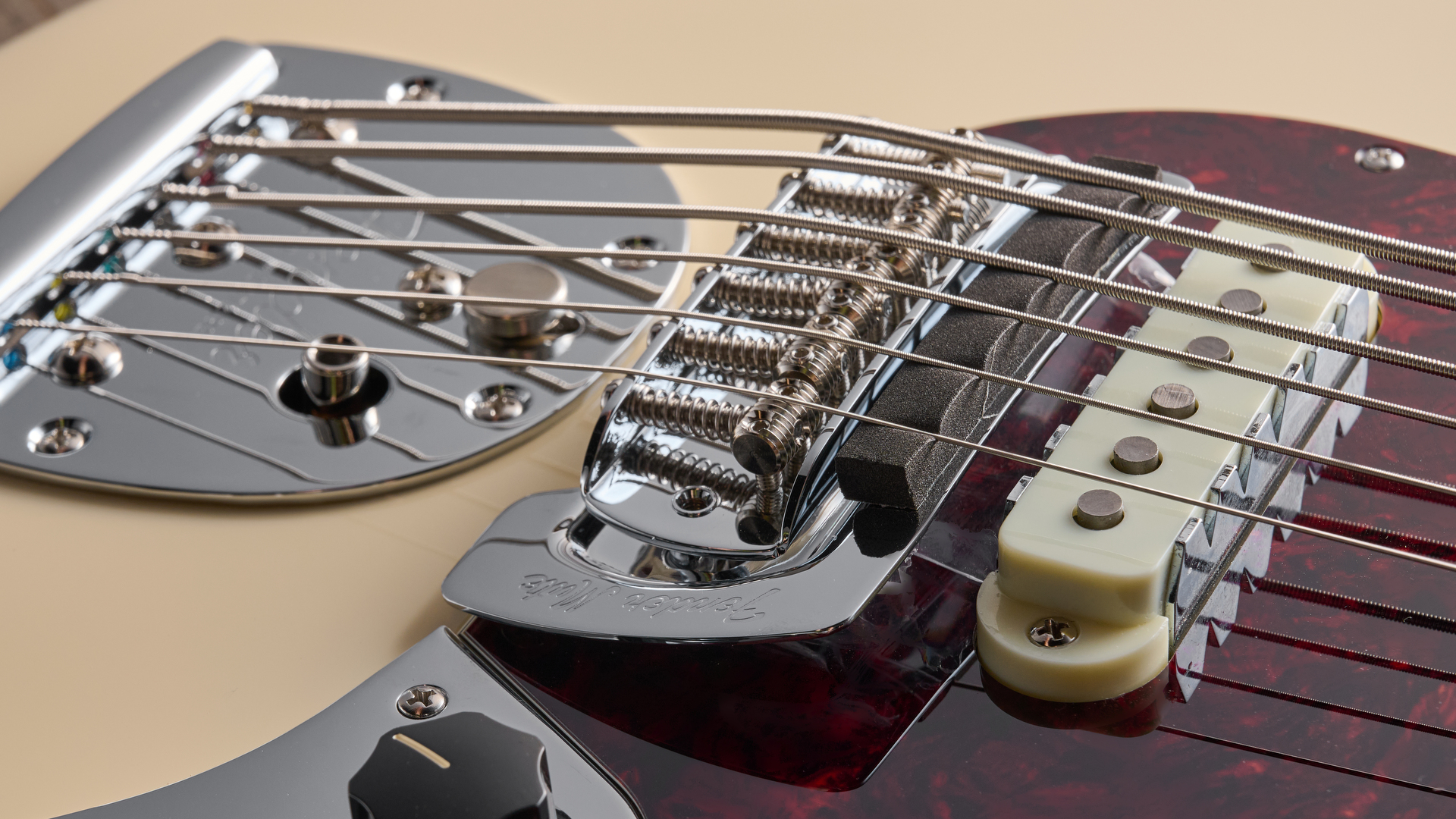 Fender Vintera III Early '60s Bass ‌VI in Olympic White with‌ red tortoiseshell ​pickguard.