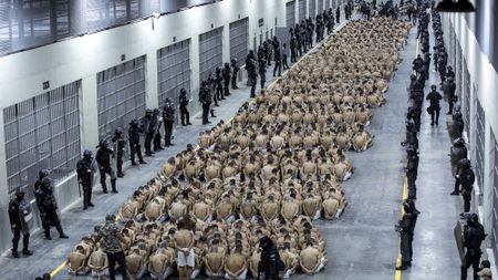 Inmates under guard in Cebot detention centre, El Salvador