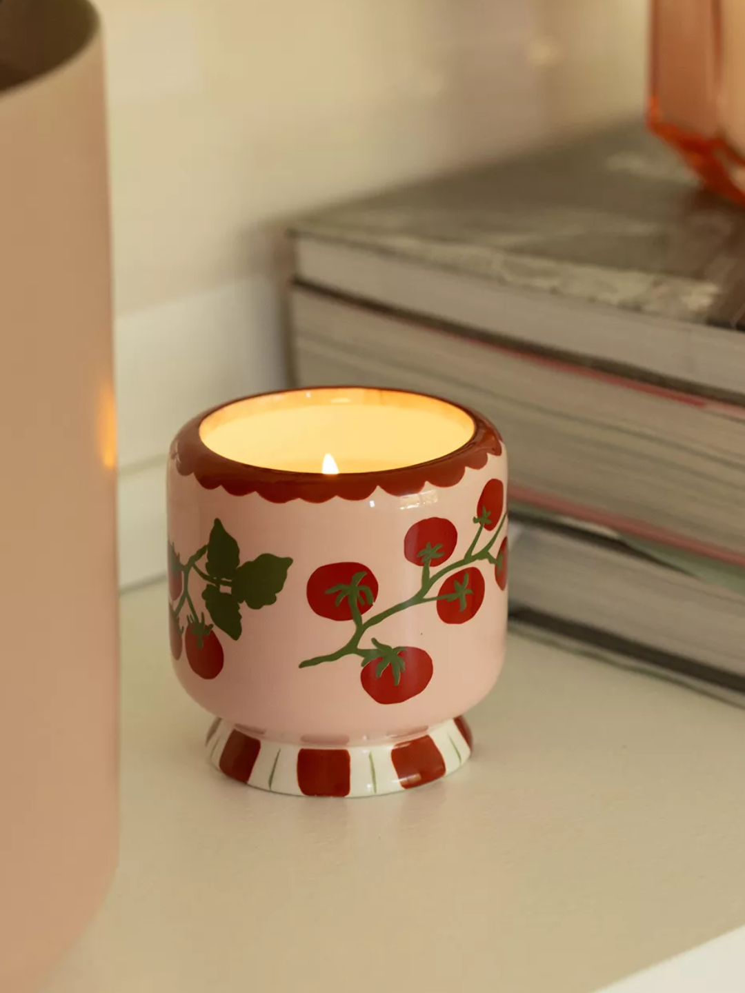 A ceramic painted tomato candle from Paddywax