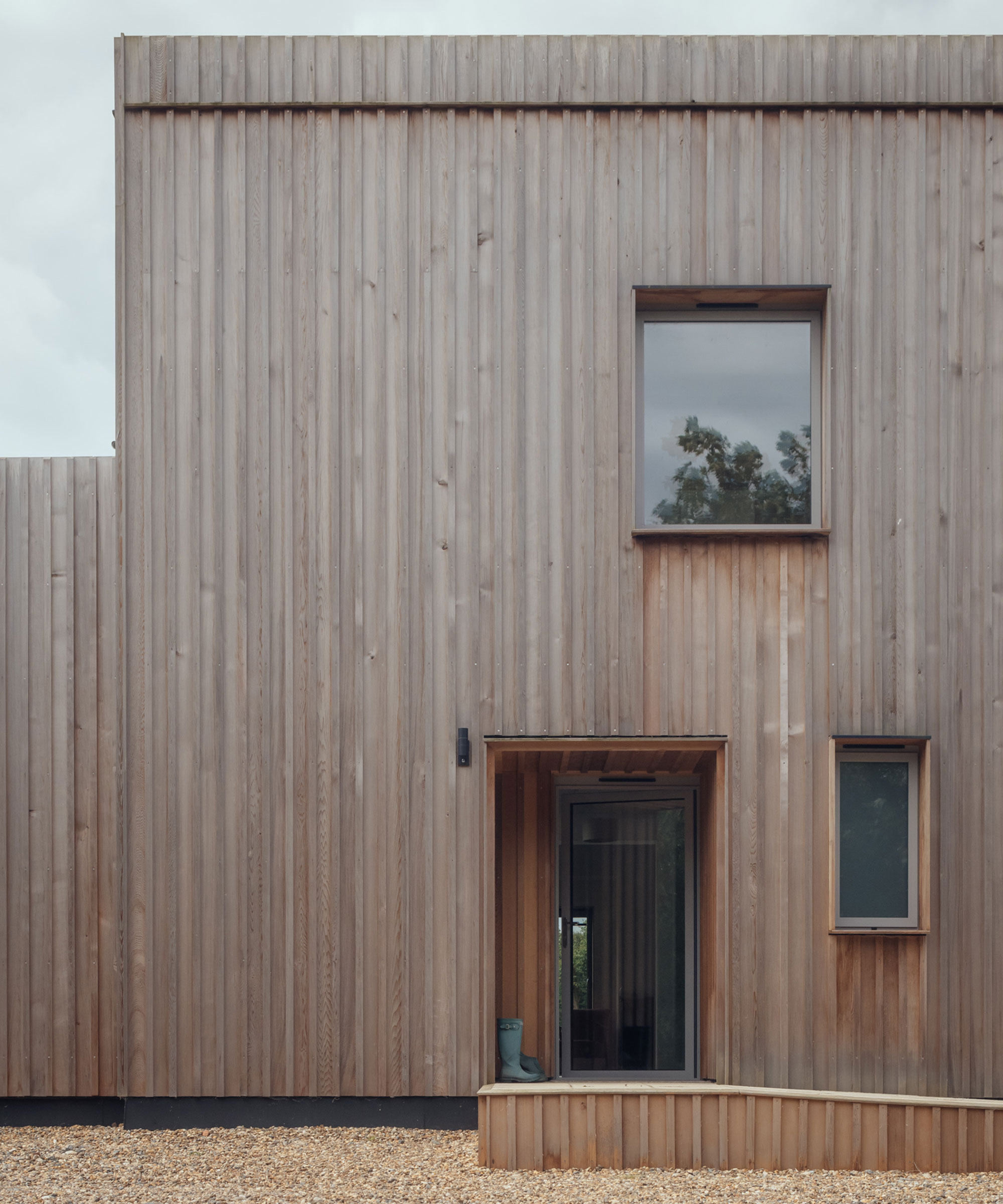 modern house with vertical timber cladding and modern porch