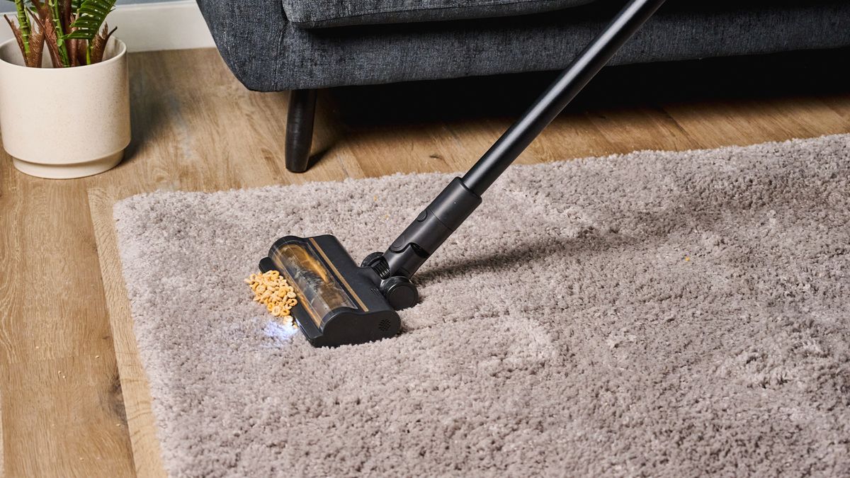 A black and gold Dreame R10 Pro cordless vacuum cleaner
