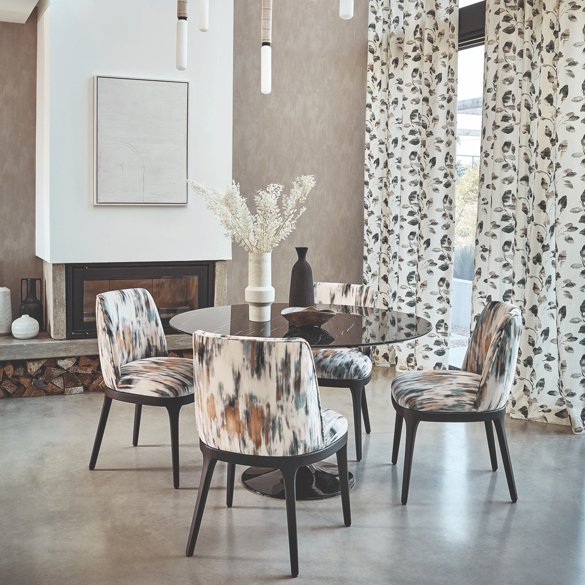Patterned curtains and chairs in dining room