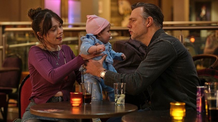 New mum Gemma (Aimee Lou Wood) hands baby Sadie to doting, yet hopeless, granddad Malcolm (David Morrissey) while enjoying drinks in an ambient setting for Daddy Issues season 2. 
