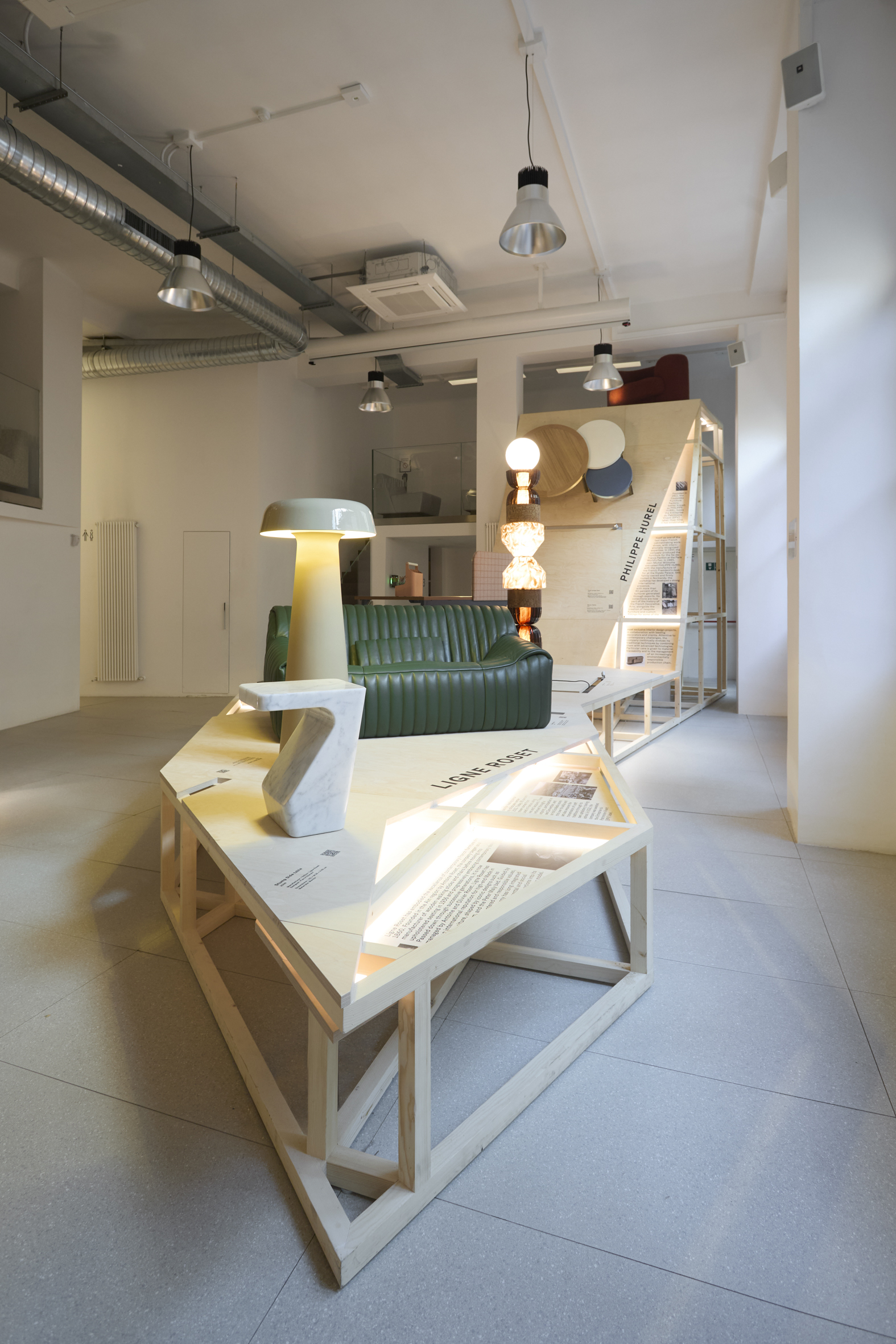 furniture and lighting displayed on timber platform