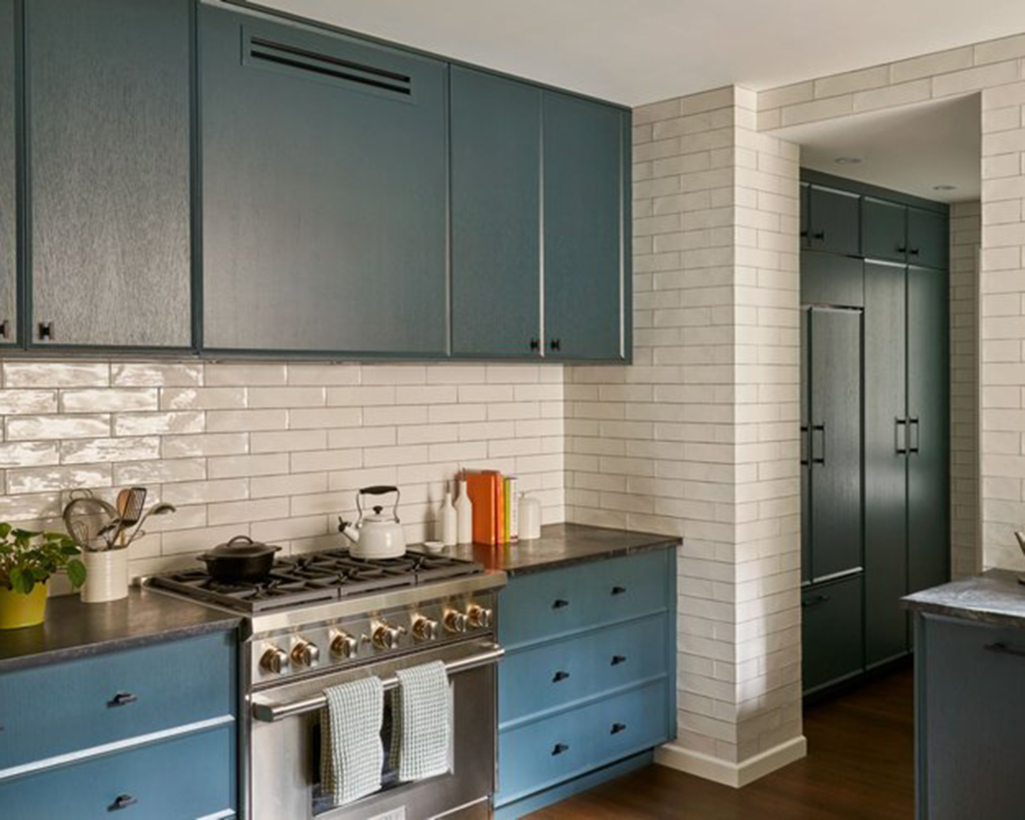 blue kitchen with white tiles