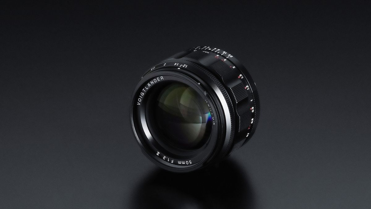 Close-up of NOKTON 50mm F1.2 Aspherical II lens, showcasing its detailed markings on a smooth black surface
