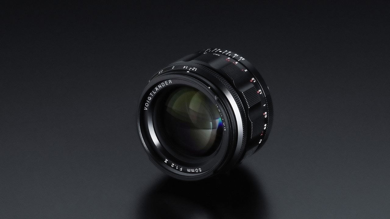 Close-up of NOKTON 50mm F1.2 Aspherical II lens, showcasing its detailed markings on a smooth black surface