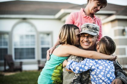 A military member father and his wife and two kids.