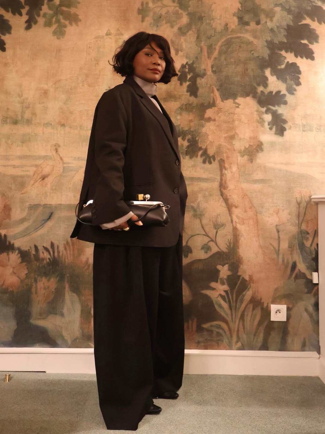 Franny Fyne wears a brown and black outfit