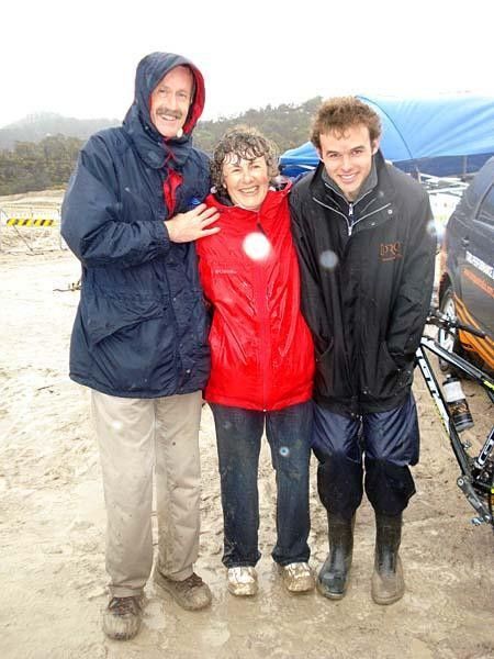 Soggy and freezing but still smiling as usual. The doting support crew, Tony and Jen Fetch, huddled here with team rider Steele Von Hoff.