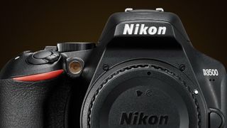 Close-up of a Nikon D3500 DSLR camera, highlighting the logo, controls, and lens, set against a black background