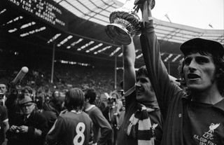 Ray Clemence and Emlyn Hughes hold the FA Cup after Liverpool's victory over Newcastle in the 1974 final