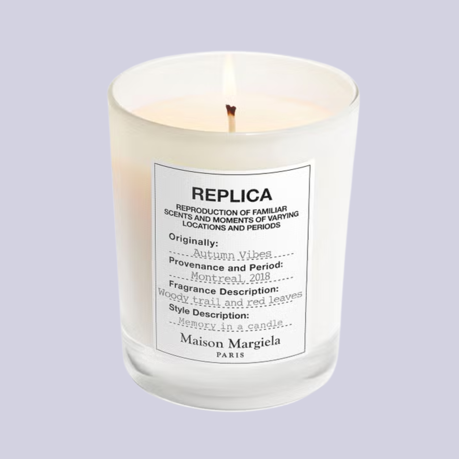 An autumn-scented white candle