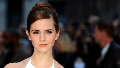 Emma Watson with her hair tied up.