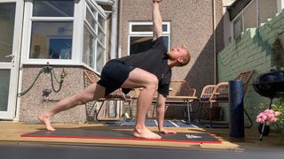 Fit&Well fitness writer Harry Bullmore performing the world's greatest stretch