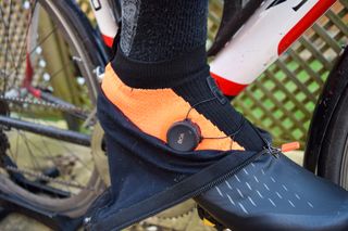 A cyclist wearing a pair of DMT WKR1 shoes