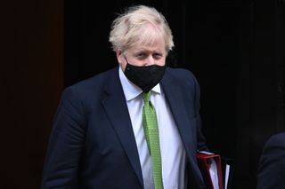 Boris Johnson leaving Downing Street for PMQs