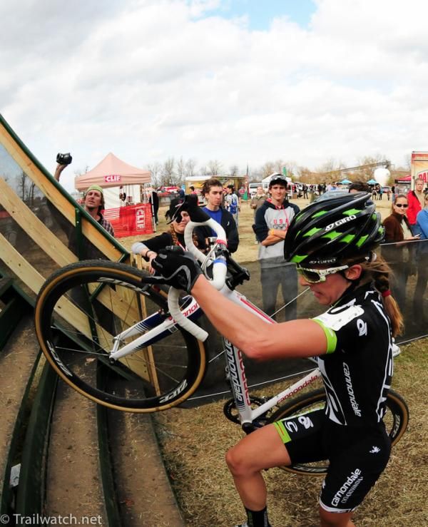 Kaitlin Antonneau (Cannondale p/b Cyclocrossworld.com) lifting her bike up the steps