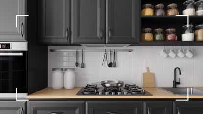 picture of black matt kitchen cabinets with wooden worktop and jars of ingredients to support an expert guide on how to clean matt kitchen cupboards