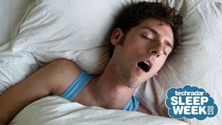A person lying in bed, snoring